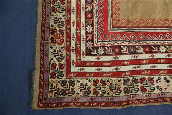 A Ghiordes red ground prayer rug, West Anatolia, 5ft 6in by 3ft 10in.